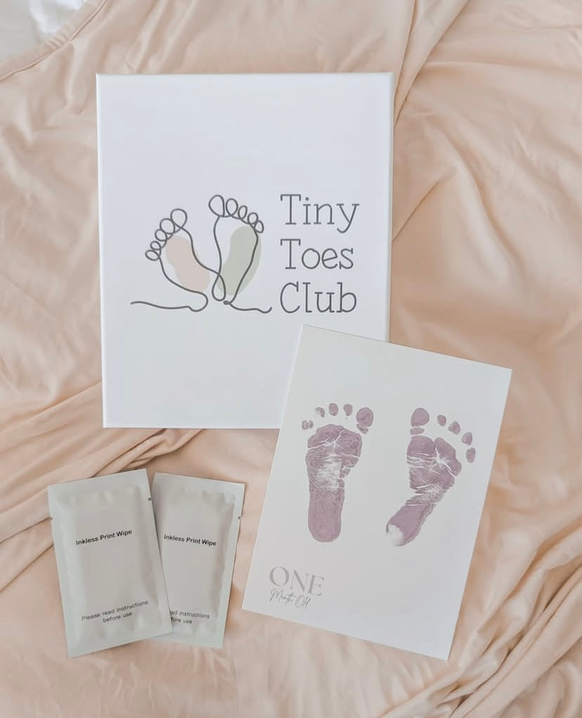 Baby footprint keepsake on a one month milestone card with inkless wipes
